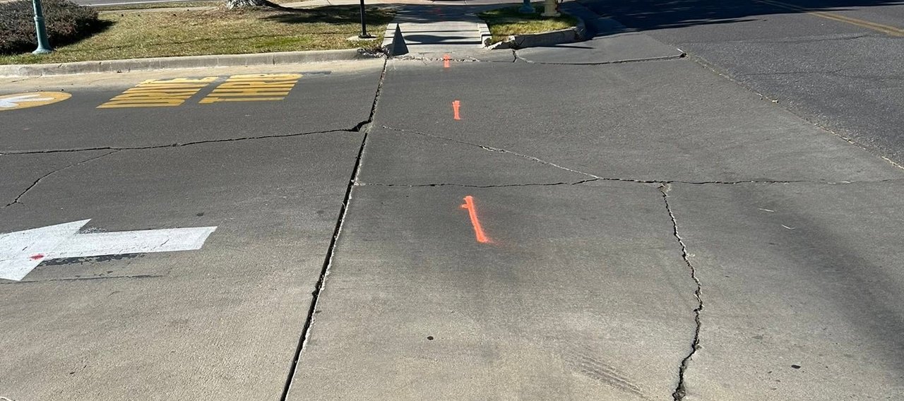 Private utility locator marking underground lines at a Colorado property